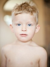 Studio portrait of shitless toddler boy (2-3). Photo : Jessica Peterson