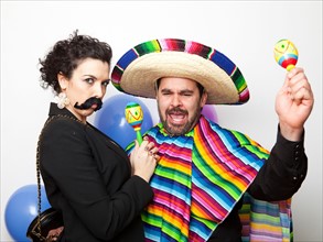 Studio Shot of two people dressed up as Mexicans. Photo : Jessica Peterson
