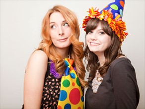 Studio Shot of young woman dressed in party hat. Photo : Jessica Peterson