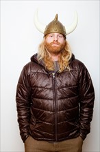 Studio Shot portrait of young man in Viking Helmet. Photo : Jessica Peterson