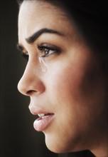 Close-up of young woman crying.