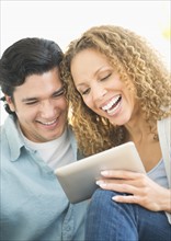 Couple looking at tablet pc.
