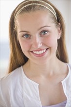 Portrait of girl (16-17) smiling.