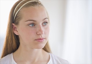 Portrait of girl (16-17) thinking.