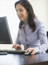 Business woman working on computer.