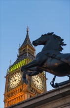 UK, England, London, Big Ben and Boadicea Statue at dusk.
