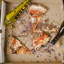 Slices of pizza and confetti in in box. 
Photo : Jamie Grill