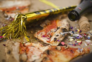 Slices of pizza and confetti in in box. 
Photo: Jamie Grill