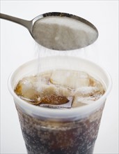 Adding sugar into soda. 
Photo : Jamie Grill