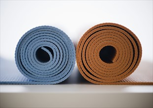 Rolled-up yoga mats. 
Photo : Jamie Grill