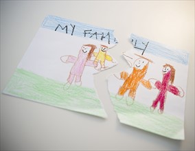 Torn child's drawing depicting family. 
Photo: Jamie Grill