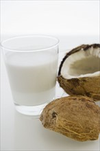 Close up of glass of milk and coconut fruit. 
Photo: Jamie Grill