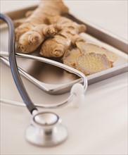 Close up of ginger root and stethoscope. 
Photo: Daniel Grill