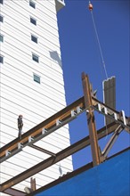 Construction worker on construction frame. 
Photo: fotog