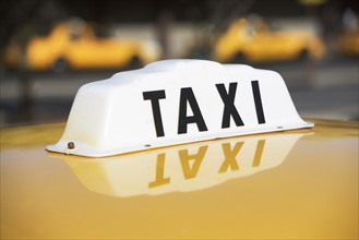 USA, New York, Long Island, New York City, Close up of taxi sign. 
Photo: fotog