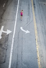 USA, California, Los Angeles, Elevated view of woman running on street. 
Photo: Erik Isakson