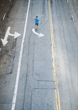 USA, California, Los Angeles, Elevated view of man and man running on street. 
Photo: Erik Isakson