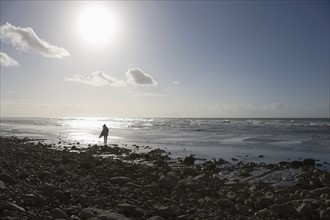 France, Pas-de-Calais, Escalles, Lonely walker on beach. 
Photo: Jan Scherders