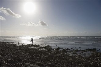 France, Pas-de-Calais, Escalles, Lonely walker on beach. 
Photo : Jan Scherders