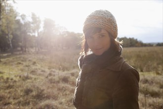 Netherlands, Utrechtse Heuvelrug, Portrait of young woman in winter countryside. 
Photo: Jan
