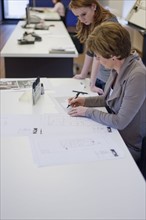Employees of design agency at work. 
Photo: Jan Scherders