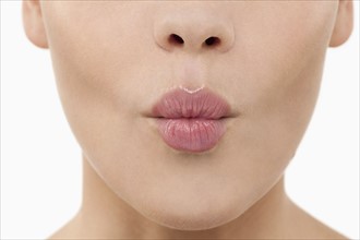Close-up of female lips blowing kiss. 
Photo: Jan Scherders