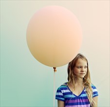 Texas, Austin, Blonde girl holding big balloon. 
Photo: King Lawrence