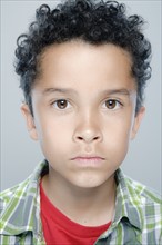Portrait of boy (8-9), studio shot. 
Photo: Rob Lewine