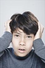 Portrait of boy (12-13) expressing stress. 
Photo : Rob Lewine