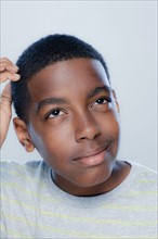 Portrait of teenage boy (14-15), studio shot. 
Photo : Rob Lewine
