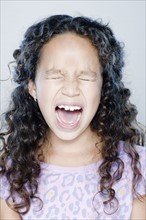 Girl (8-9) screaming, studio shot. 
Photo: Rob Lewine