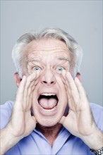 Portrait of screaming senior man, studio shot. 
Photo : Rob Lewine