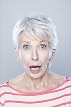 Portrait of surprised senior woman, studio shot. 
Photo: Rob Lewine