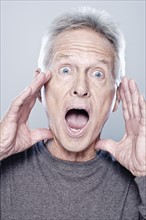 Portrait of screaming senior man, studio shot. 
Photo: Rob Lewine
