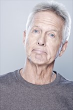 Portrait of confused senior man, studio shot. 
Photo: Rob Lewine