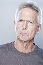 Portrait of angry senior man, studio shot. 
Photo: Rob Lewine