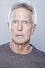 Portrait of shocked senior man, studio shot. 
Photo: Rob Lewine