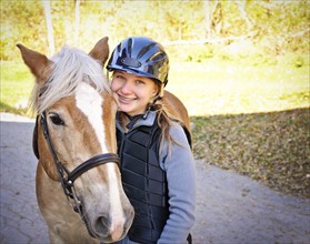 Portrait of teenage girl (16-17) with horse. 
Photo : Elena Elisseeva