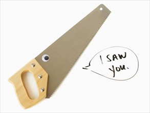 Hand saw with text in speech bubble, studio shot. 
Photo : Jessica Peterson
