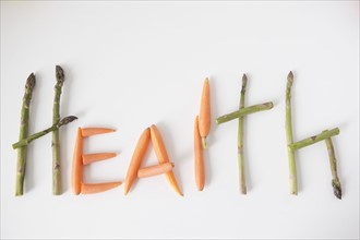 Word 'health' made out of vegetables, studio shot. 
Photo: Jessica Peterson