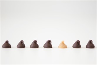 Chocolate sweets on white background, studio shot. 
Photo : Jessica Peterson