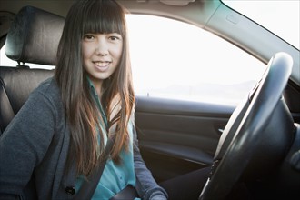 Portrait of young woman in car. 
Photo : Jessica Peterson