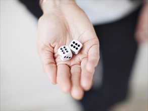 High angle view of hands with dices. 
Photo: Jessica Peterson