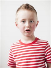 Portrait of disappointed toddler boy (2-3) . 
Photo: Jessica Peterson