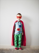 Portrait of toddler boy (2-3) in superhero costume. 
Photo: Jessica Peterson