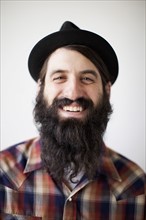 Profile of male character wearing long beard, hat and lumberjack shirt. 
Photo: Jessica Peterson