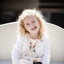 Outdoor portrait of happy young girl (4-5) . 
Photo: Jessica Peterson