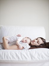 Mother and baby girl (2-5 months) sleeping together. 
Photo : Jessica Peterson