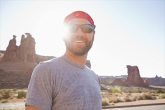 USA, Utah, Moab, Mid adult man posing in cycling gear. 
Photo : Jessica Peterson