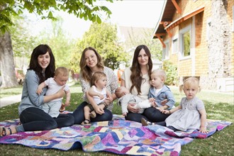 USA, Utah, Salt Lake City, Three young mothers with two baby boys (6-11 months), toddler boy and